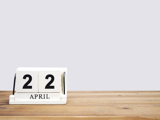 wood block calendar on brown wooden table