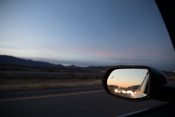 natural view on right and traffic behind the car in driver side mirror