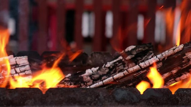 Open fire in iron barbecue stove