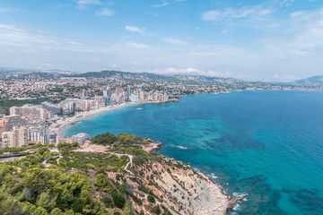 Top view of the Mediterranean, the coast and the city of Calpe in Spain on the Costa Blanca on a beautiful, sunny, holiday day.