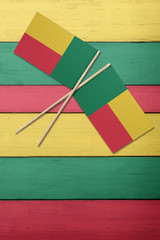 Benin Two flags on a painted wood background