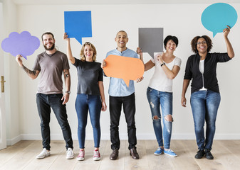 People carryng speech bubble icons