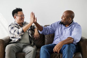 Men joining hands together