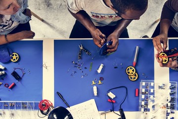 Technician in workshop working together