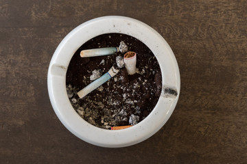 Burnt cigarette butts and ashes.