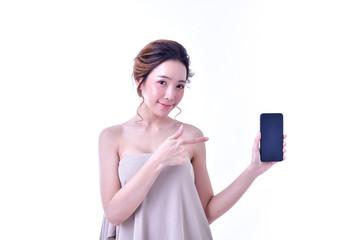 The concept of healthy beautiful woman. Beautiful women keep healthy. Beautiful woman hands holding the mobile phone. Beautiful young woman using finger pointing at mobile phone.