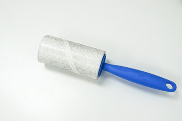 isolated lint roller for remove fur from clothes and men suit