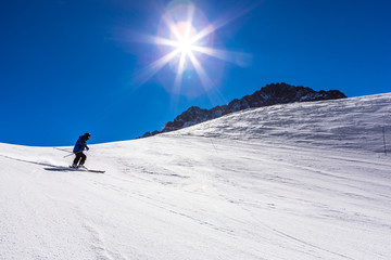 ski in chile on a sunny day with lots of snow.