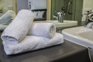selective focus white towel on wash basin in luxury bathroom in hotel