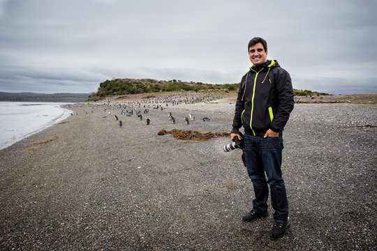 Photographer standing with camera in hand in Martillo Island, wi