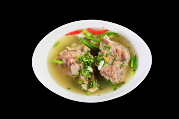 Spicy Pork with Pork bone Soup on the Wood Table. Leng soup thai style