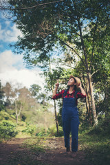 young woman walking in the forest