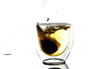 glass of water / Iced tea is a form of cold tea with sugar or a sweetener added in it.