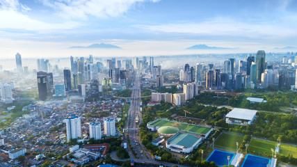 Fototapeta na wymiar Skyscrapers and Senayan stadium at morning time