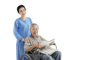 Old man and nurse smiling at the camera