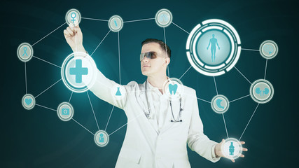 European male doctor working with virtual screen