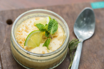 Lemon cheese cake on wooden plate