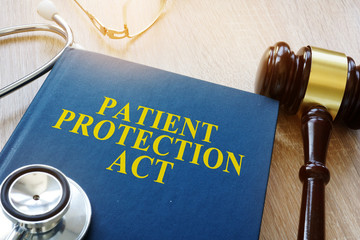 Patient protection act and gavel on a table.
