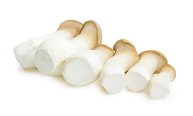 Row of uncooked Eringi mushrooms closeup at selective focus