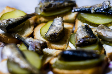 sandwich with sprats and cucumber