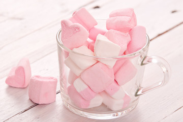 Marshmallows on wooden table. 