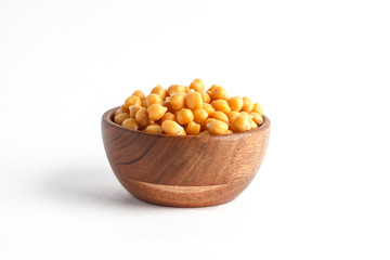 Wooden bowl of preserved (boiled) chickpea isolated on white background
