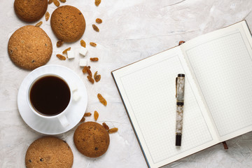 Cup of coffee with biscuits and a Diary of the Breakfast Concept