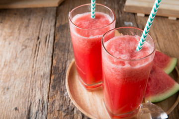 Watermelon smoothie on wood background