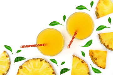 juice in a glass and pineapple slices decorated with leaves isolated on white background with copy space for your text