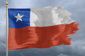 Chile Flag with torn edges in front of a stormy sky
