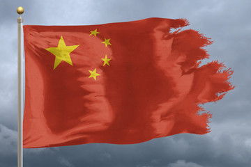 China Flag with torn edges in front of a stormy sky