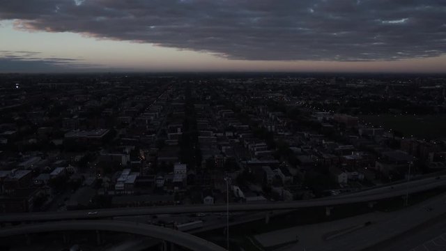 Chicago aerial view ascending over Stevenson Expressway and Dan Ryan Expressway at sunrise
