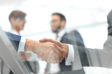 Business men shaking hands. Closeup.