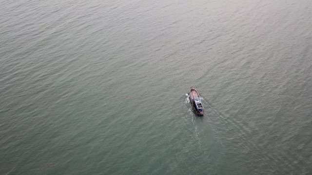 Top view. Aerial view from drone. Royalty high quality free stock footage of the fishing boat on the beach. Fishing boat is push off go to beach. Vietnam