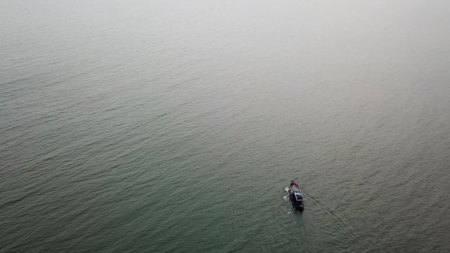 Top view. Aerial view from drone. Royalty high quality free stock footage of the fishing boat on the beach. Fishing boat is push off go to beach. Vietnam