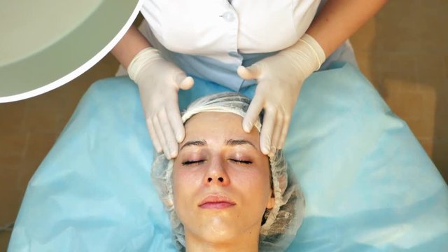 Skin Rejuvenation Treatment massage with facial cream, 4k footage.