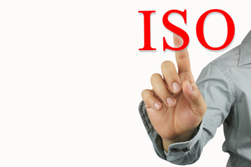 Fototapeta premium Hand of businessman point to the red ISO text isolated on white background.