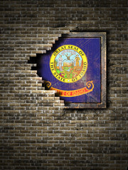 Old Idaho flag in brick wall