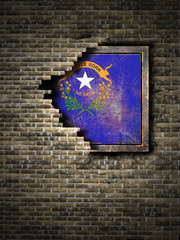 Old Nevada flag in brick wall