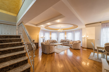 Interior of a luxury, open plan, living room with round, circle, ceiling