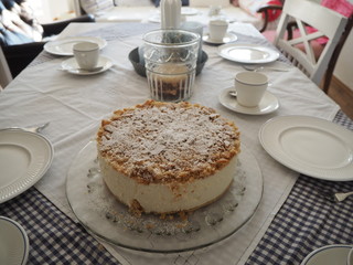 birthday cake on a table with white setting
