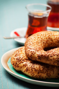 Turkish food: simit bread and cup of tea, shallow DOF