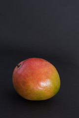 Mango fruit on black background