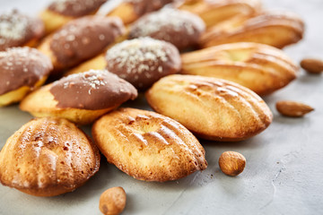 Tasty almond cookies arranged in the shape of fan on white background, close-up, selective focus