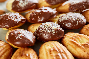 Tasty almond cookies arranged in the shape of fan on white background, close-up, selective focus