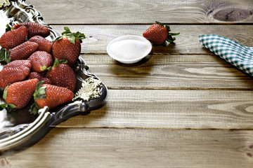 strawberries with sugar on wood