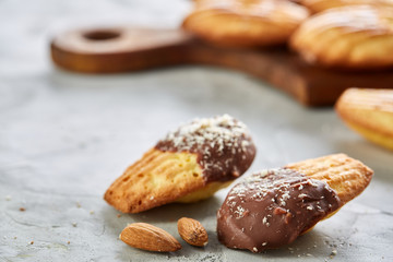 Tasty almond cookies arranged in the shape of fan on white background, close-up, selective focus