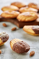 Tasty almond cookies arranged in the shape of fan on white background, close-up, selective focus
