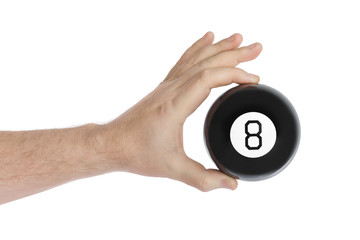 Hand with magic billiard ball number eight