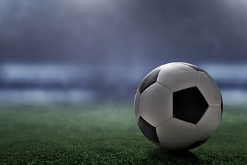 Naklejka premium Soccer ball on the field